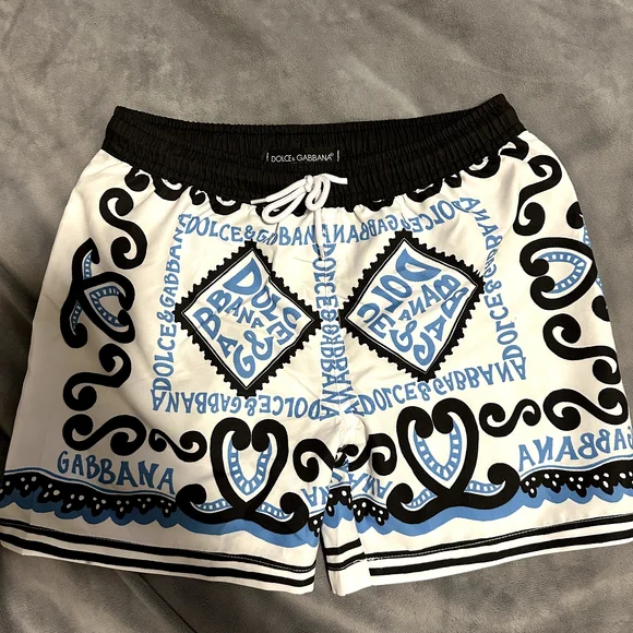 Dolce & Gabbana Kids Swim Trunks in White with Black and Blue Patterns - Picture 1 of 2